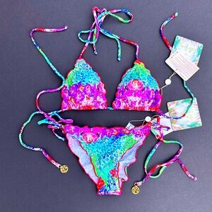 Crystallized wavey trim triangle top, bikini bottom with a flirty scrunch.